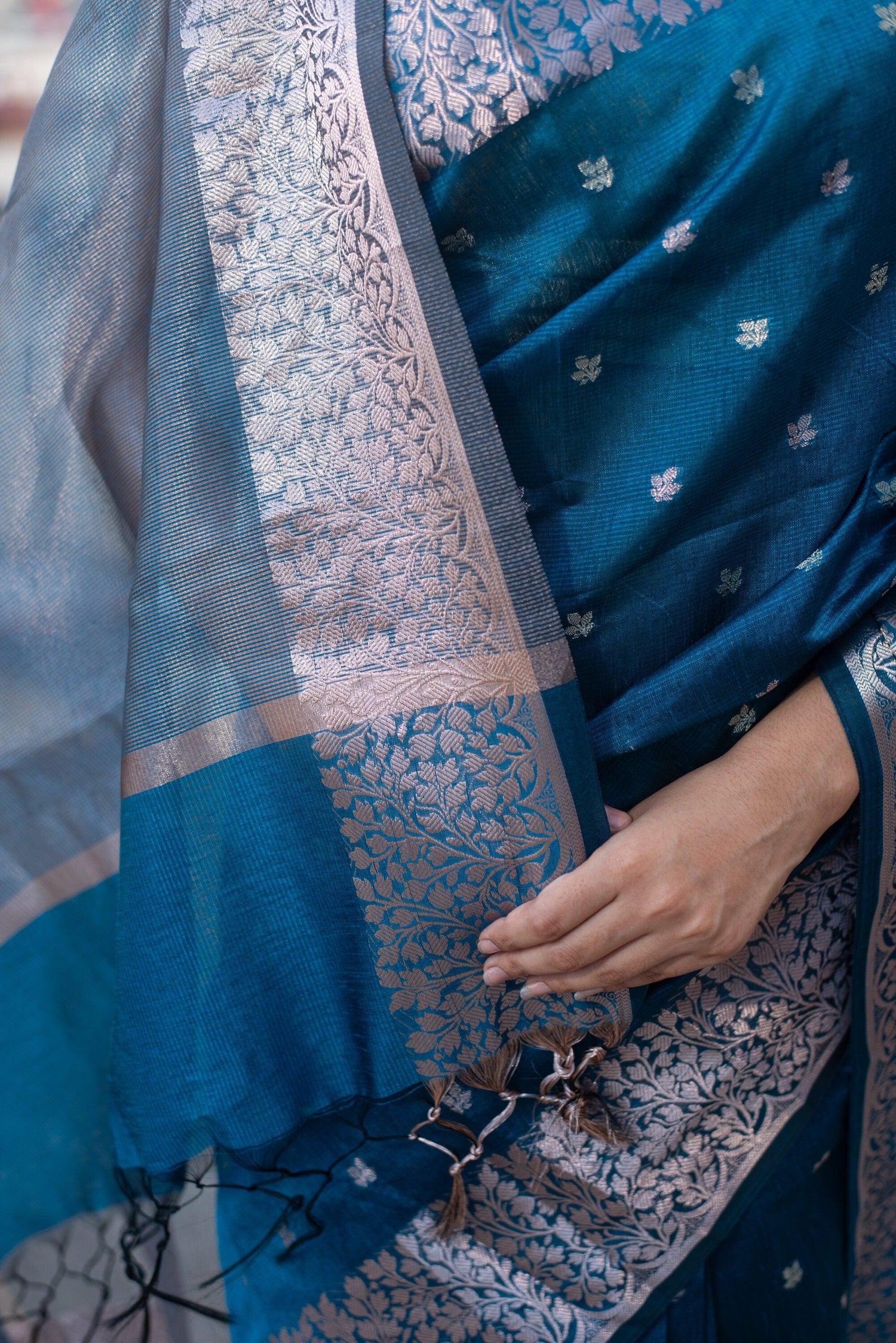 Blue Banarasi cotton saree with silver zari work and floral border detail